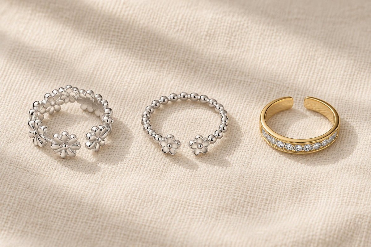 Sterling silver, stainless steel and gold-tone plated toe rings side by side