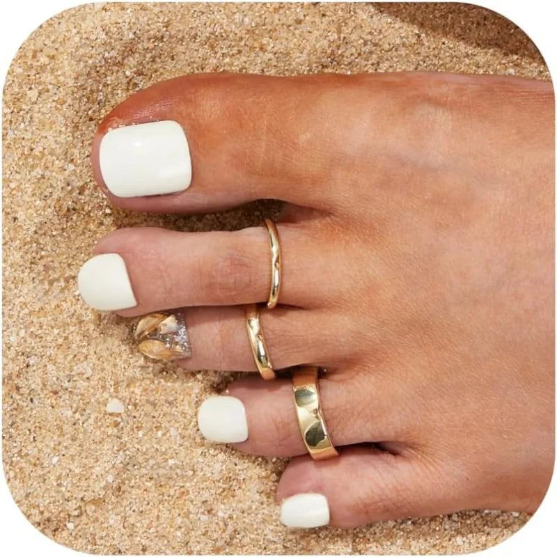 Plain toe ring trio worn on a foot