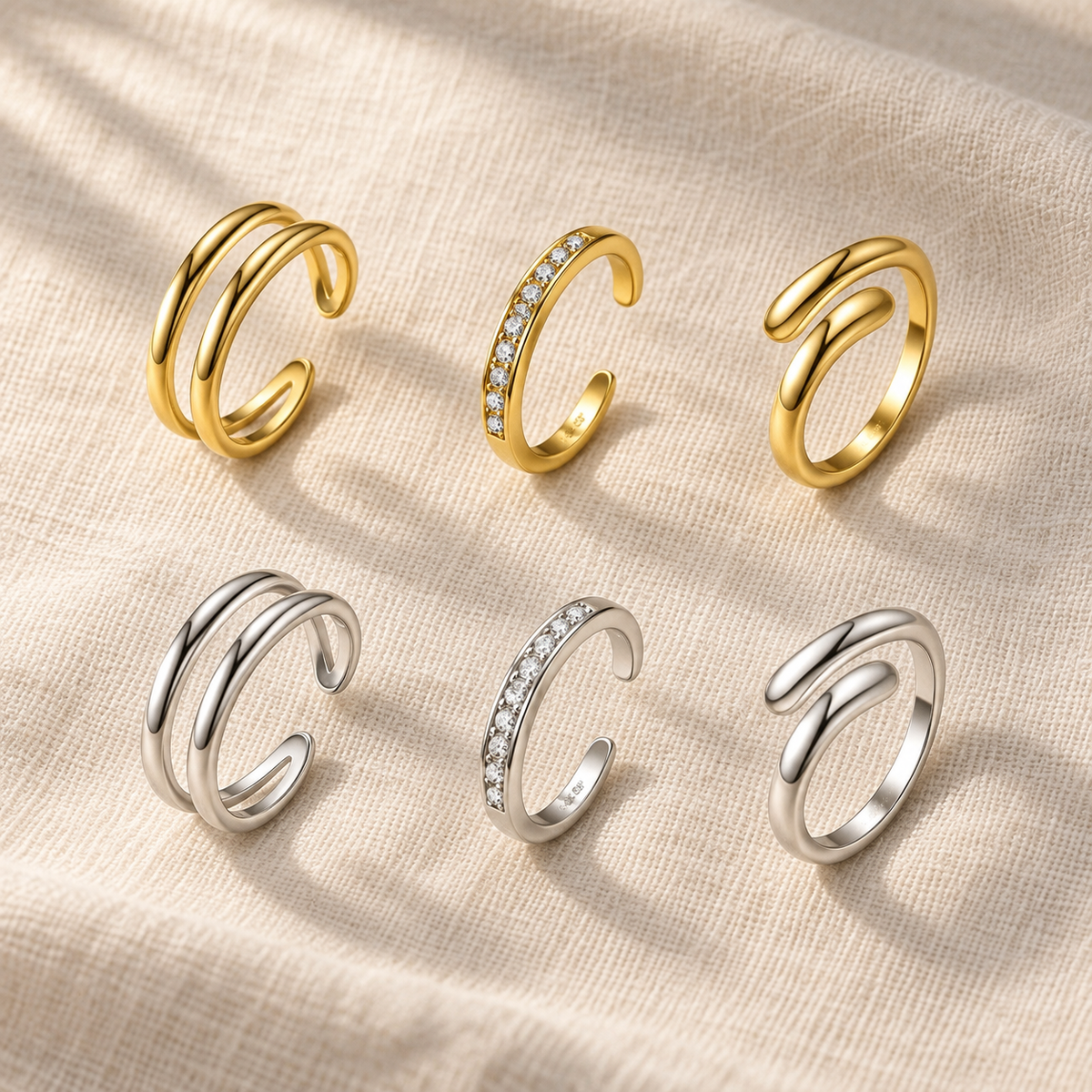 Stacking toe rings shown in gold and silver finishes on linen