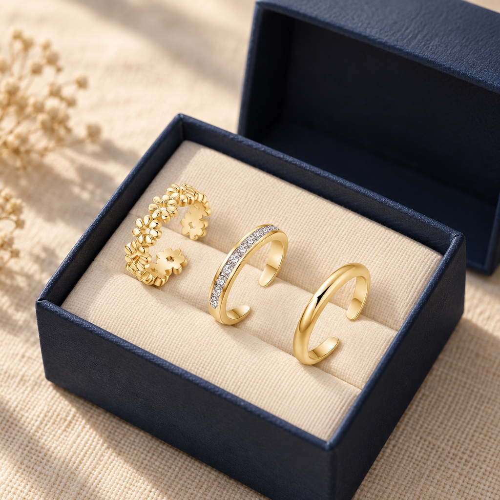 Three-piece toe ring set in an open navy gift box
