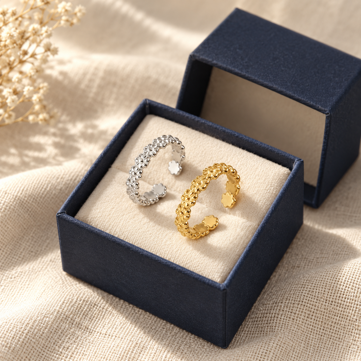 Floral adjustable toe ring in an open navy gift box
