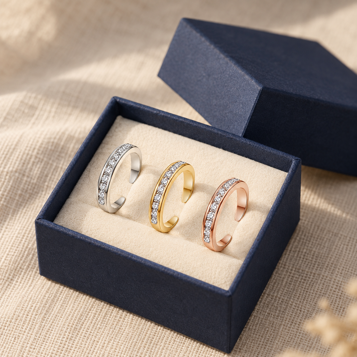 Adjustable toe ring in an open navy gift box