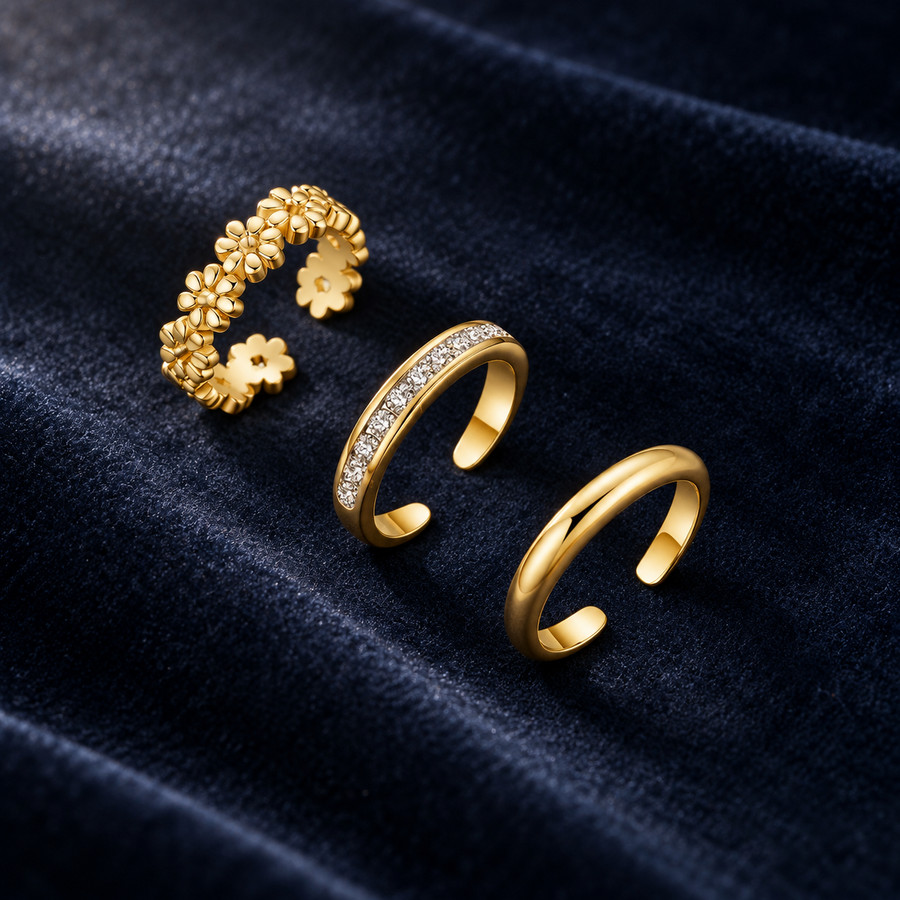 Daisy-chain, crystal and plain toe rings on deep navy velvet