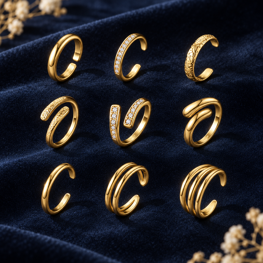 Nine stacking toe rings laid out on deep navy velvet