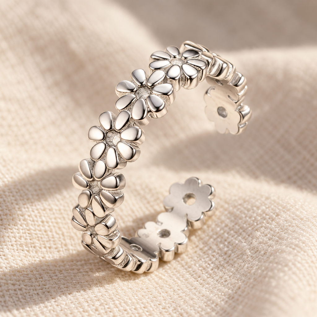 Macro detail of the sterling silver daisy-chain toe ring