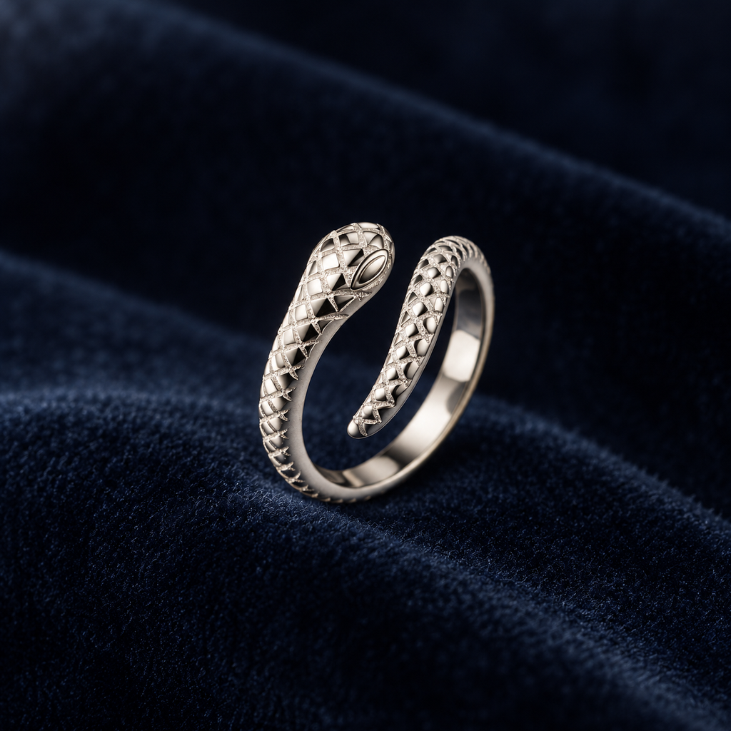 Sterling silver snake toe ring on deep navy velvet
